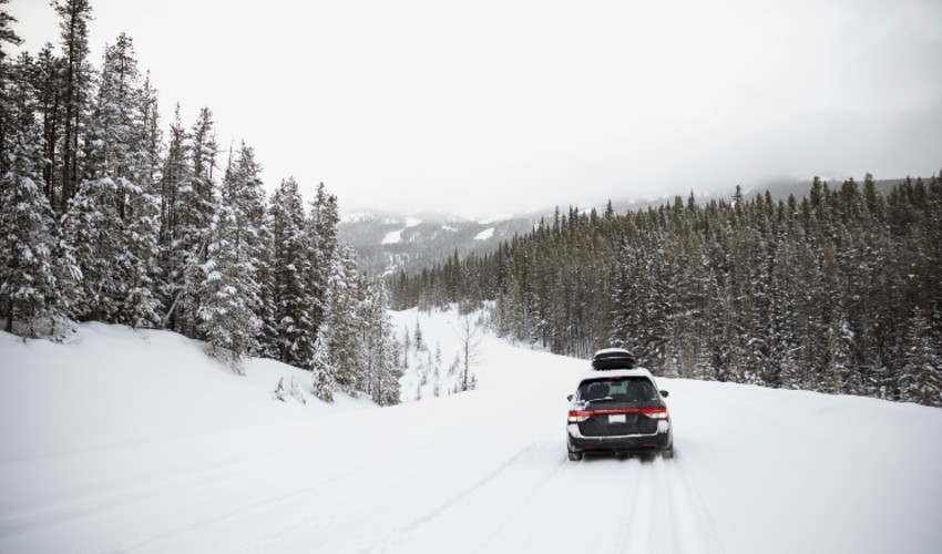https://www.caasco.com/-/media/caasco/blog/automotive/2019/11/blog-img--car-driving-on-snow-covered-remote-road.jpg