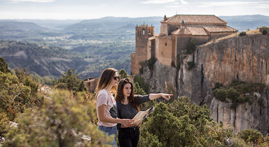 two young women with map on a hiking trip